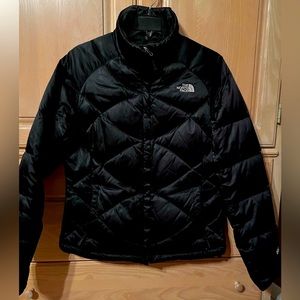 Black North Face puffer jacket.